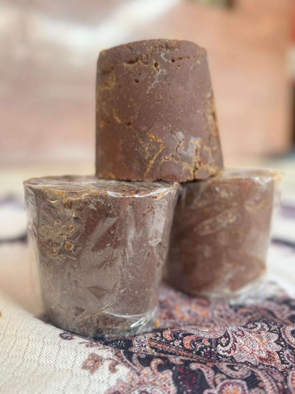 Close-up of premium jaggery blocks displaying natural texture and quality